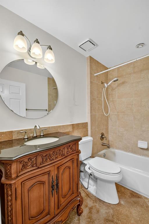 1620 Northwest 22nd Avenue Delray Beach, FL 33445 - Photo 38 of 63 a bathroom with a toilet a sink and mirror