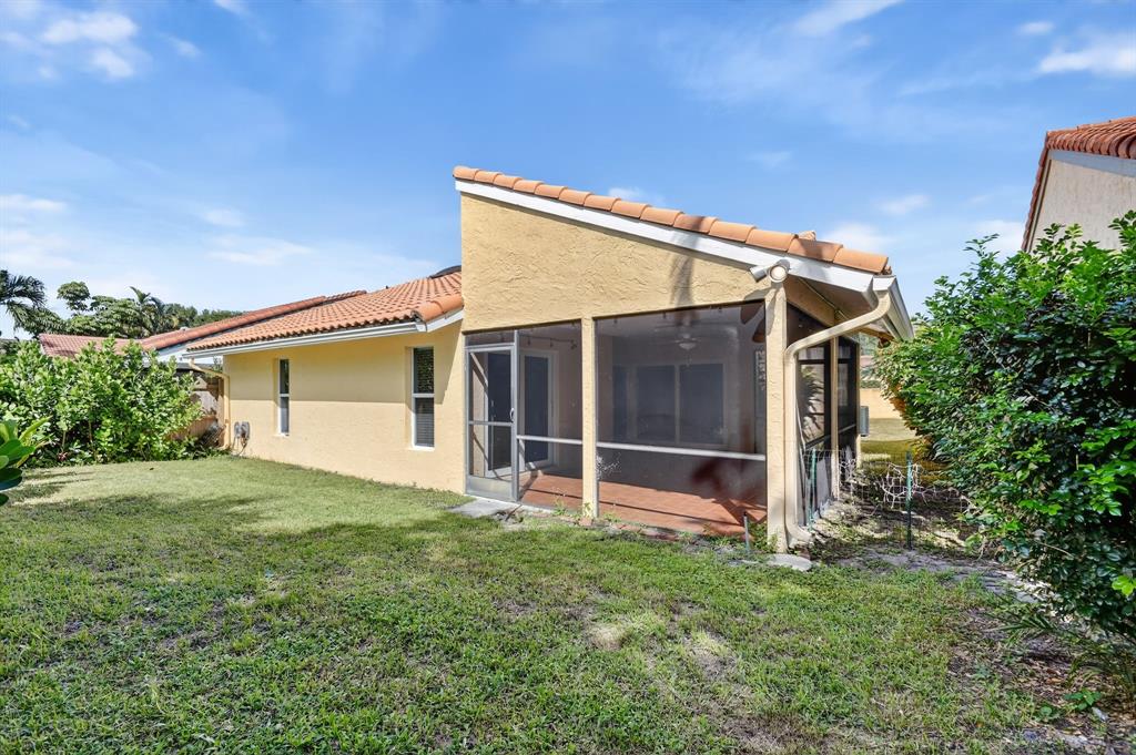 1620 Northwest 22nd Avenue Delray Beach, FL 33445 - Photo 44 of 63 a view of a house with a yard and sitting area