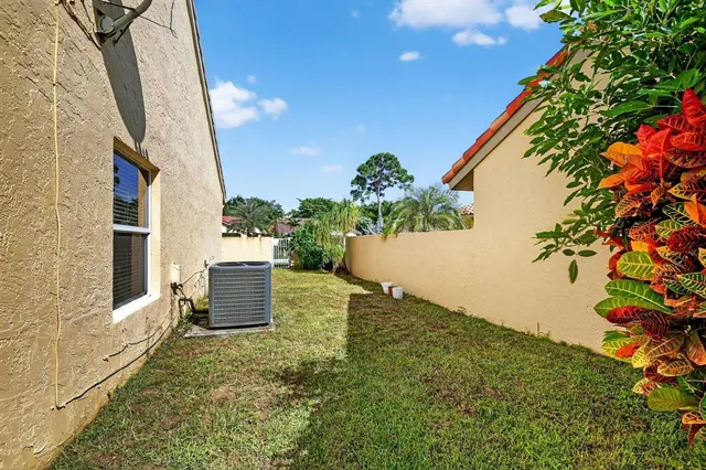 swimming pool view with a seating space