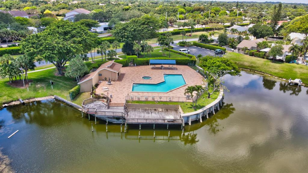 1620 Northwest 22nd Avenue Delray Beach, FL 33445 - Photo 54 of 63 an aerial view of a house with a garden and lake view