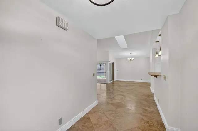 a view of a kitchen with a sink and a window