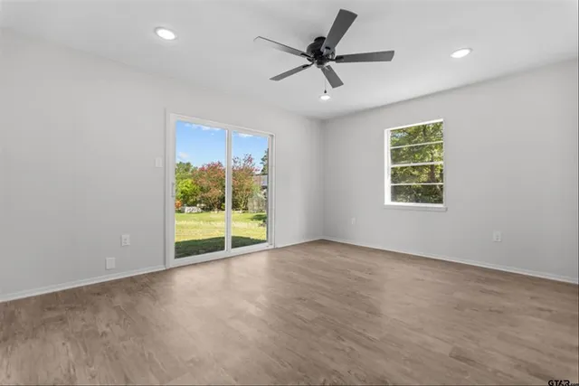 a view of an empty room with a window