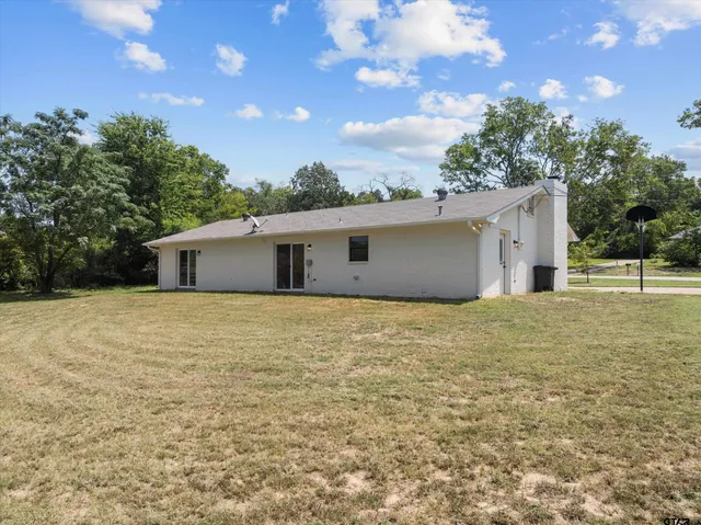 a house view with a backyard space