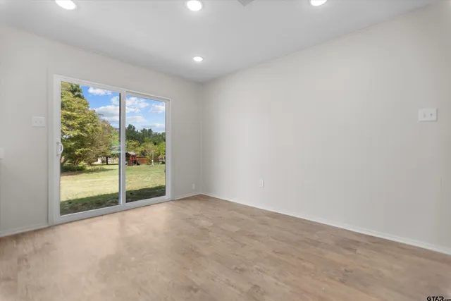 a view of an empty room with a sliding door