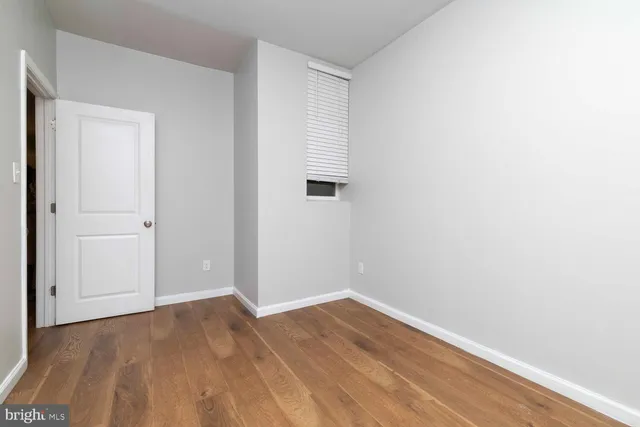 a view of a room that has wooden floor in it