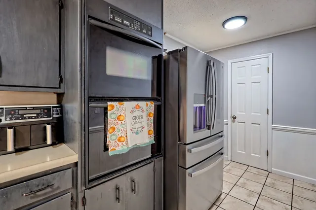 a kitchen with stainless steel appliances granite countertop lots of counter top space and cabinets