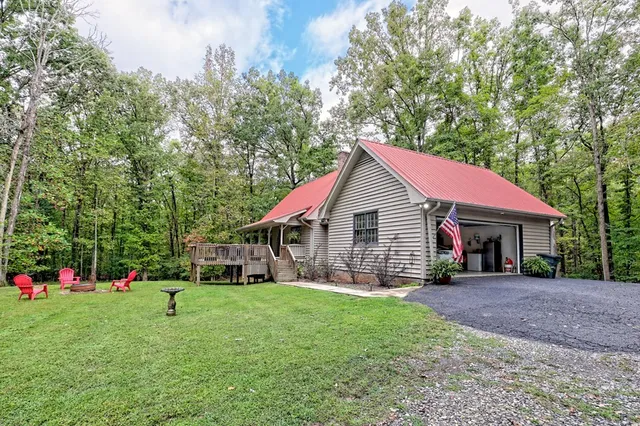 a view of a house with a deck and a patio