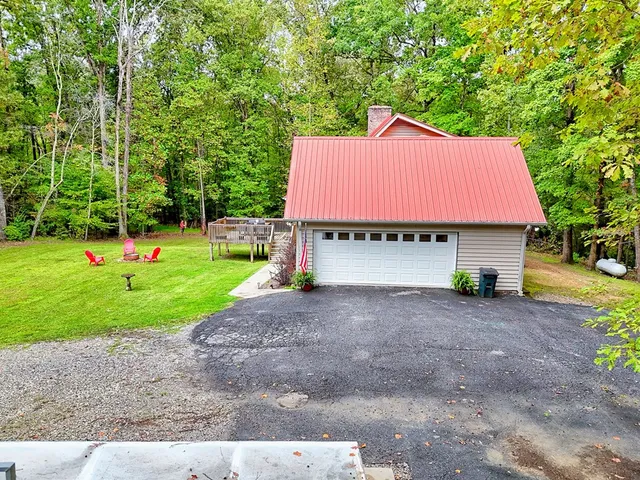 a view of a lush green hillside and a houses