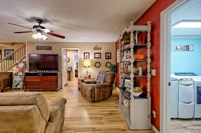 a living room with furniture and a flat screen tv