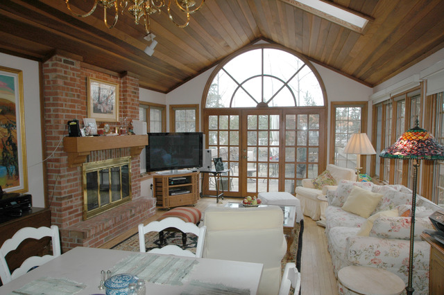 1551 Edgewood Road Lake Forest, IL 60045 - Photo 5 of 6 a living room with furniture a fireplace and a flat screen tv