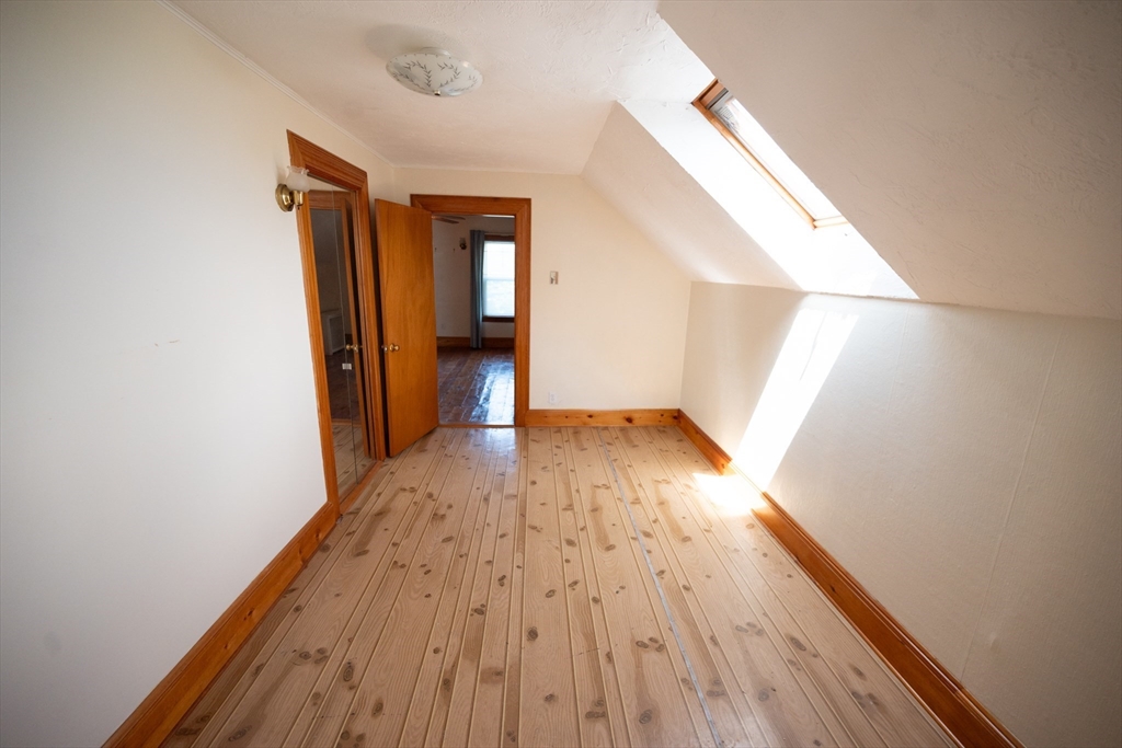 4 Winter Street Clinton, MA 01510 - Photo 17 of 33 a view of hallway with wooden floor