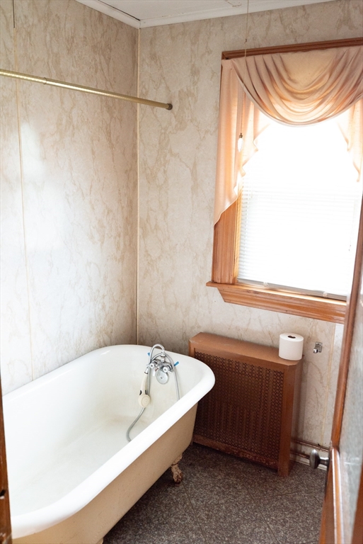 4 Winter Street Clinton, MA 01510 - Photo 26 of 33 a bathroom with a bathtub and a shower