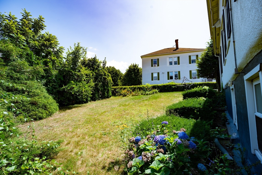 4 Winter Street Clinton, MA 01510 - Photo 27 of 33 a view of a house with a yard