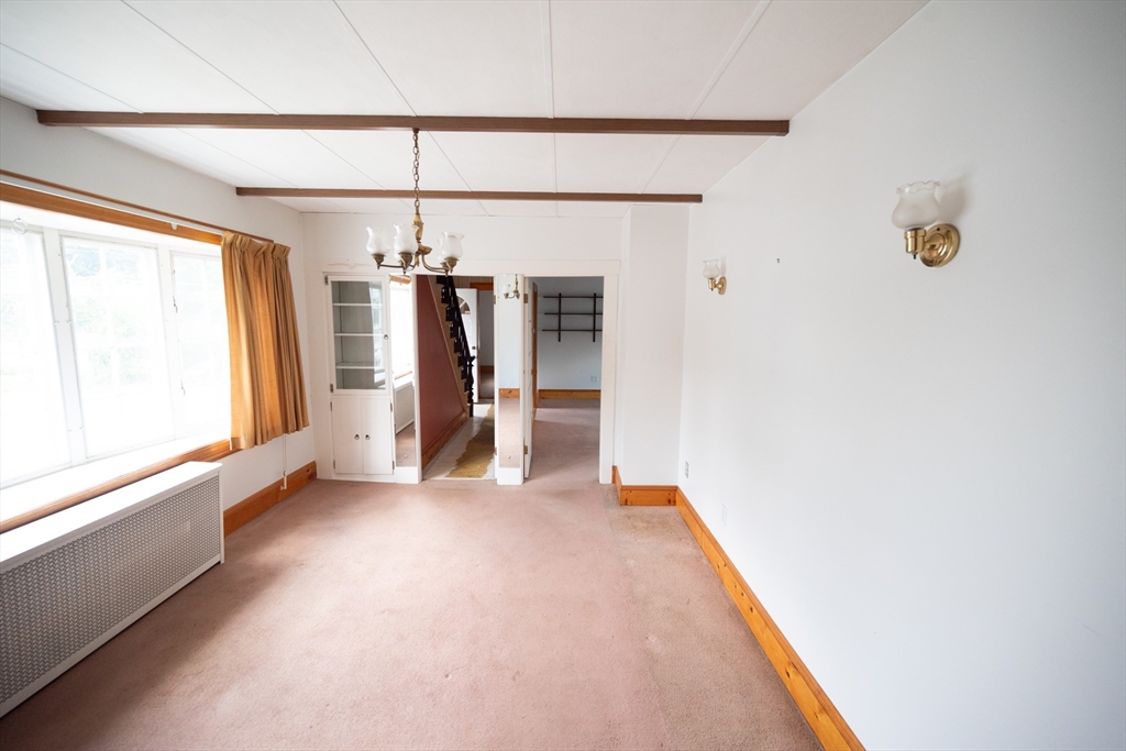 4 Winter Street Clinton, MA 01510 - Photo 4 of 33 a view of a room with a window and storage