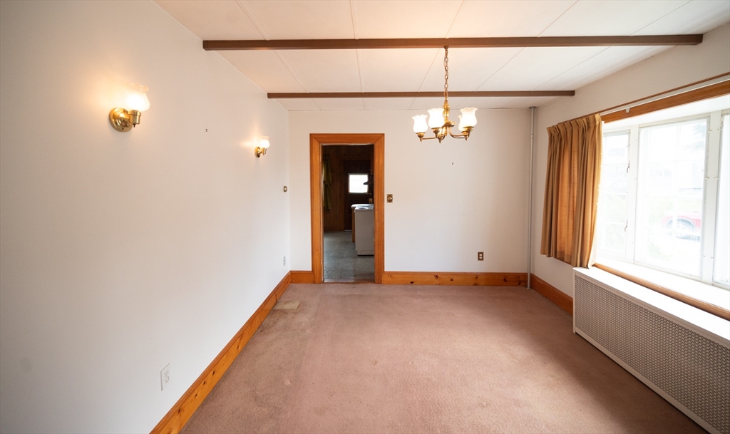 4 Winter Street Clinton, MA 01510 - Photo 5 of 33 a view of a livingroom with a chandelier fan and windows
