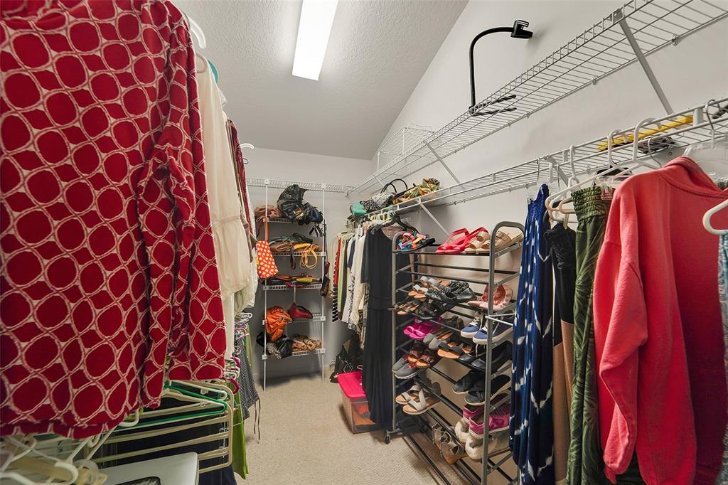 6898 Grenelefe Road Boynton Beach, FL 33437 - Photo 28 of 65 a view of walk in closet with clothes