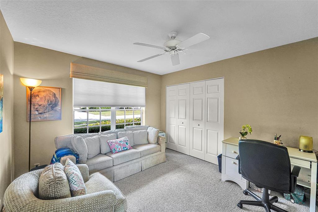 6898 Grenelefe Road Boynton Beach, FL 33437 - Photo 29 of 65 a living room with furniture and a large window