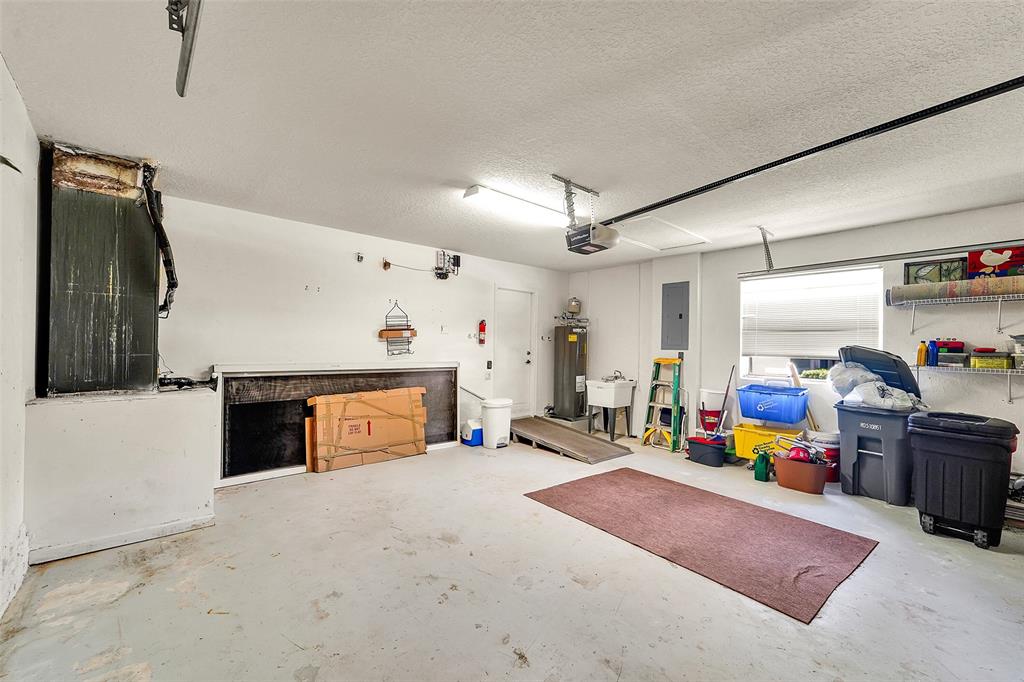 6898 Grenelefe Road Boynton Beach, FL 33437 - Photo 36 of 65 a living room with furniture and a flat screen tv