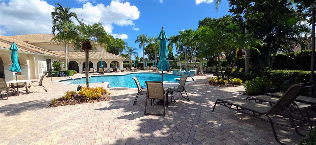 6898 Grenelefe Road Boynton Beach, FL 33437 - Photo 45 of 65 a view of a patio with table and chairs and potted plants