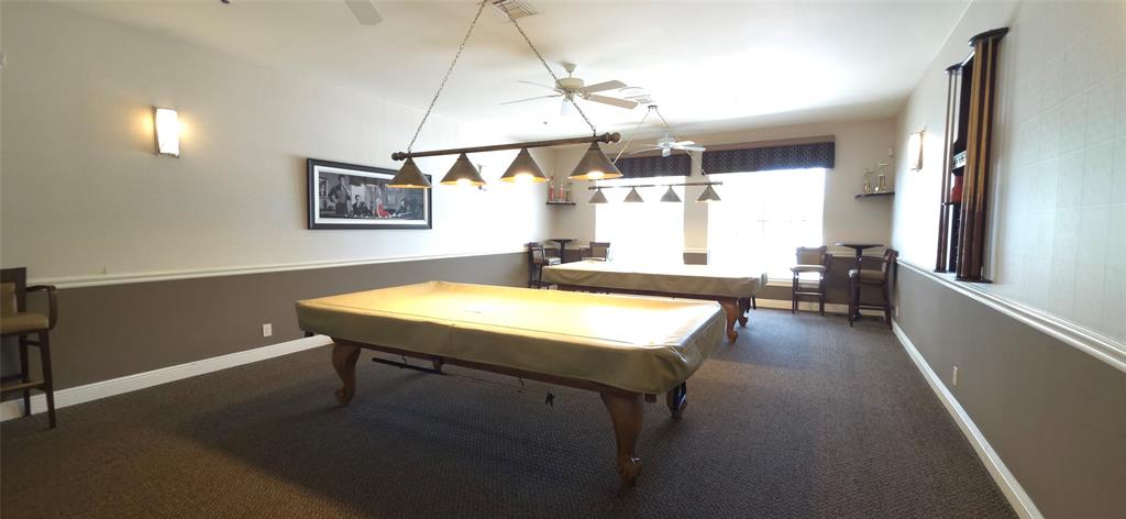 6898 Grenelefe Road Boynton Beach, FL 33437 - Photo 51 of 65 a room with a table chairs and a wooden floor