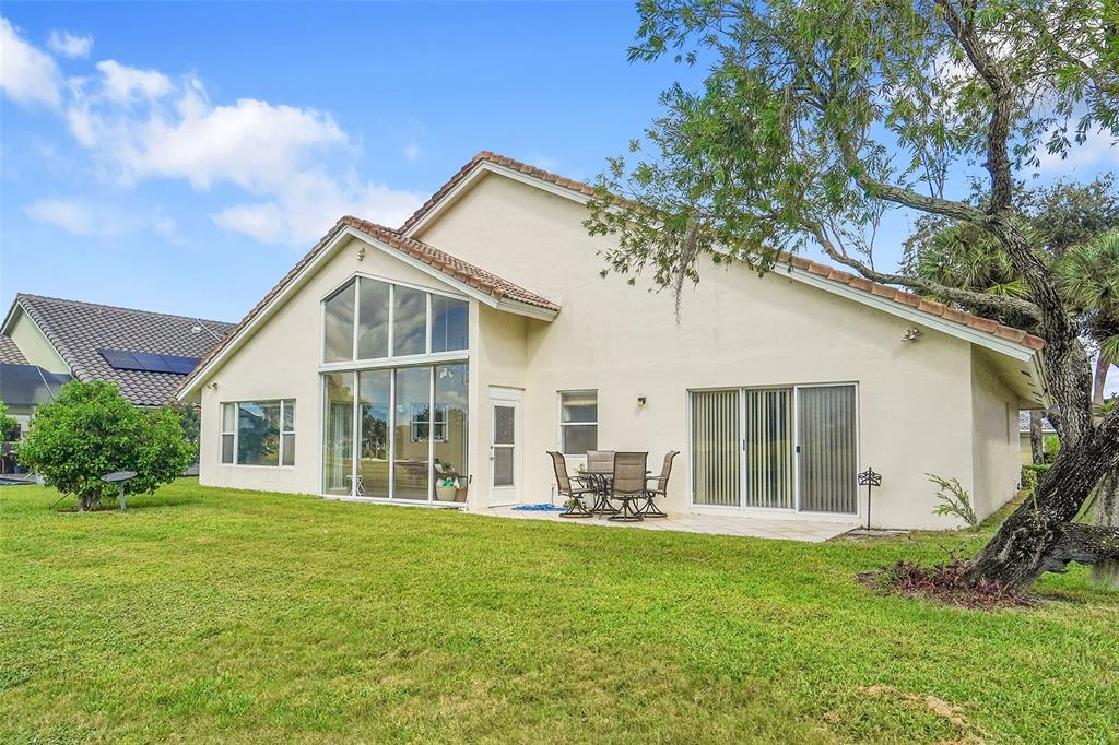 6898 Grenelefe Road Boynton Beach, FL 33437 - Photo 6 of 65 a view of a house with a yard