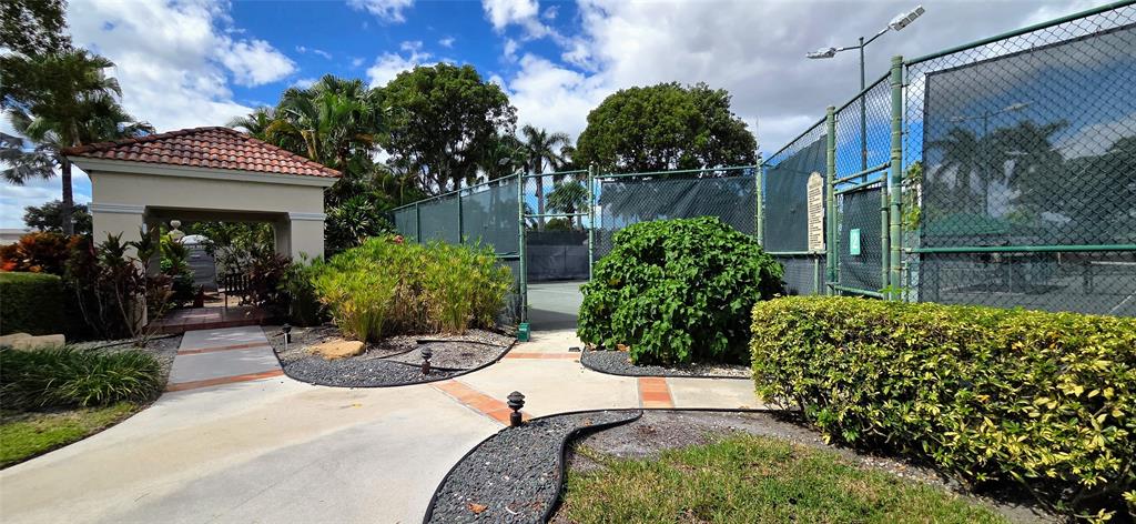 6898 Grenelefe Road Boynton Beach, FL 33437 - Photo 65 of 65 a view of a house with a backyard and sitting area