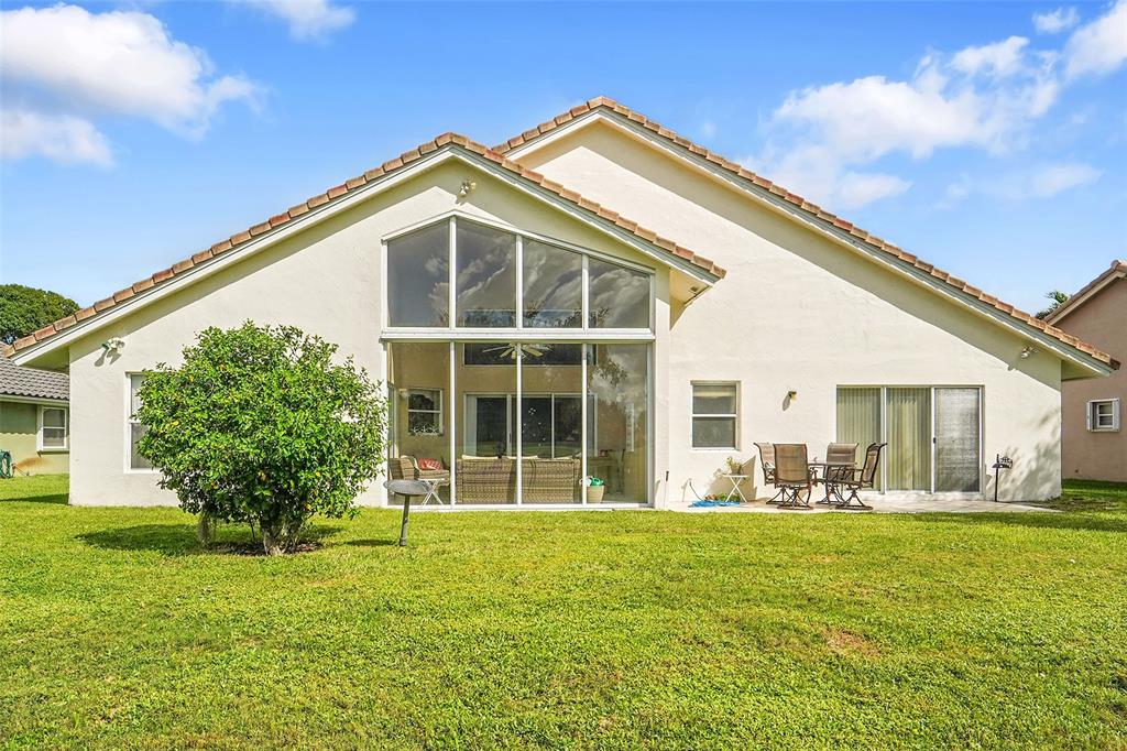 6898 Grenelefe Road Boynton Beach, FL 33437 - Photo 7 of 65 a front view of house with yard
