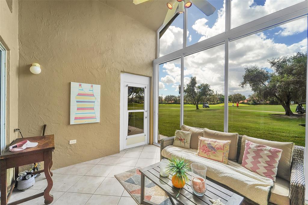 6898 Grenelefe Road Boynton Beach, FL 33437 - Photo 8 of 65 a view of a patio with couches chairs and a yard