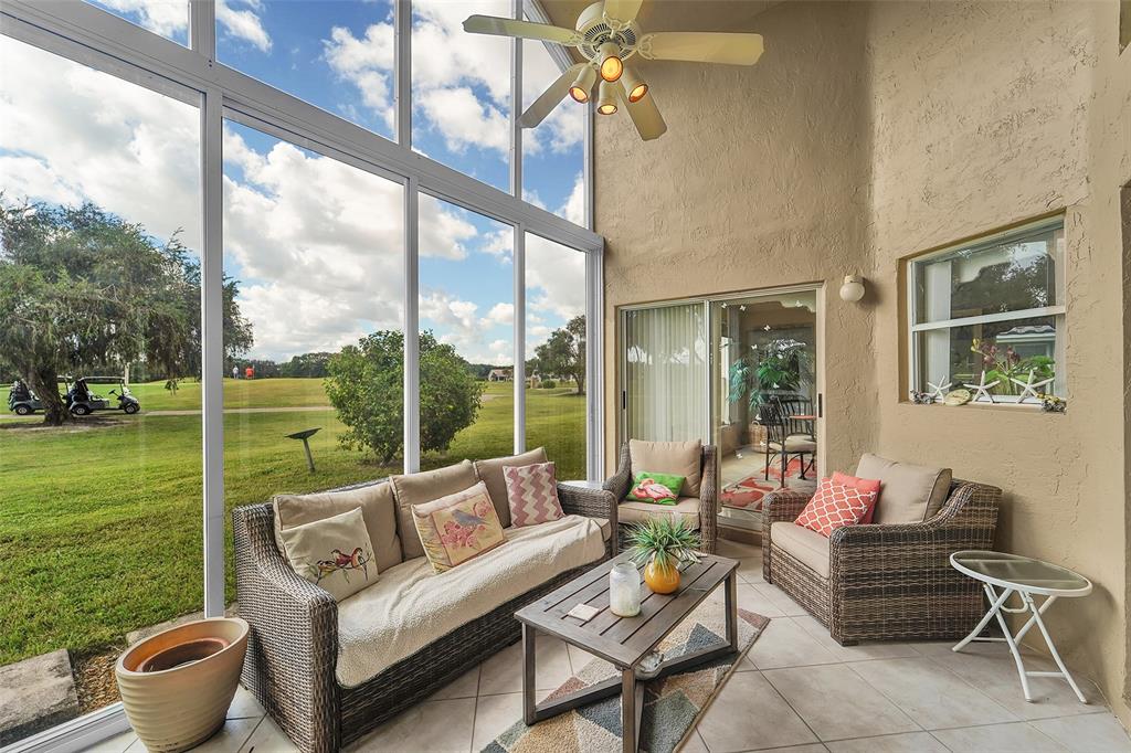 6898 Grenelefe Road Boynton Beach, FL 33437 - Photo 10 of 65 a living room with patio furniture and garden view