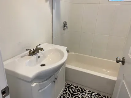 a bathroom with a sink and a bathtub