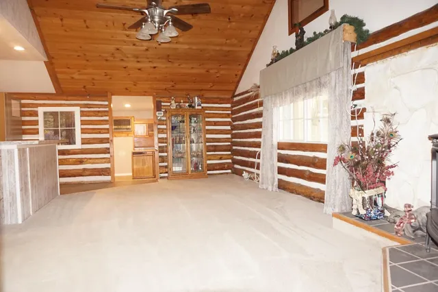 a kitchen with granite countertop a stove a sink and a microwave