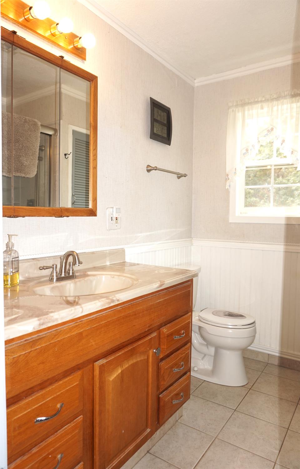 20480 Timber Ridge Road Pine Grove, CA 95665 - Photo 31 of 56 a bathroom with a granite countertop sink toilet and mirror