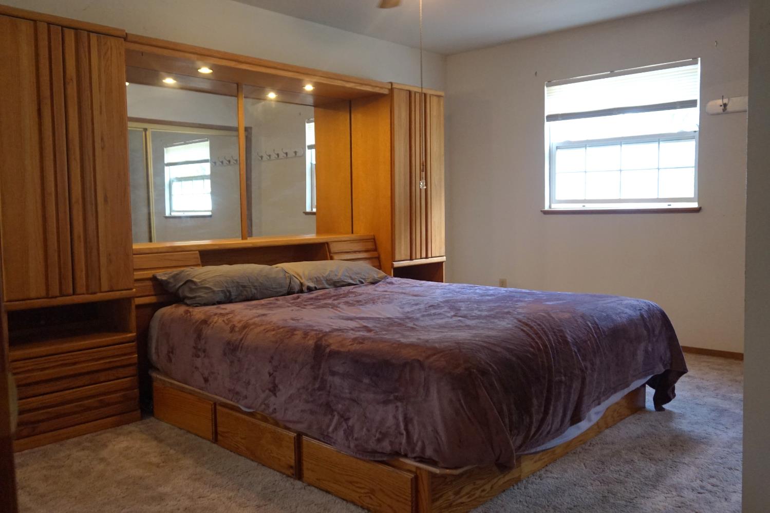 20480 Timber Ridge Road Pine Grove, CA 95665 - Photo 33 of 56 a spacious bedroom with a bed and window