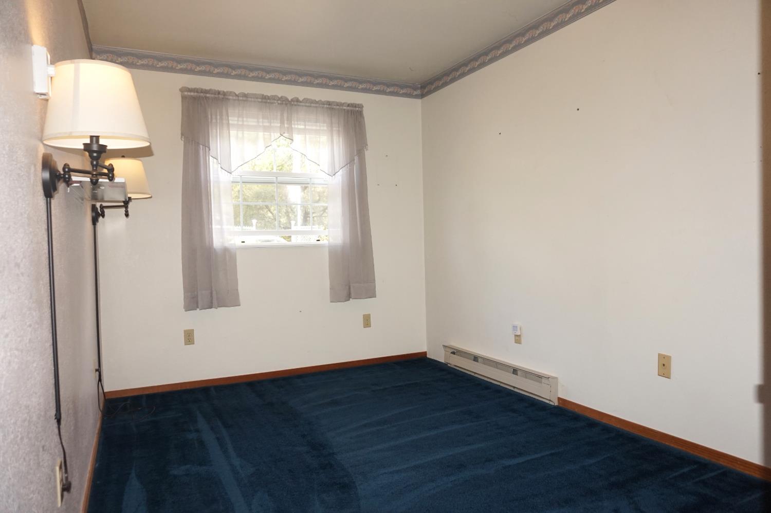 20480 Timber Ridge Road Pine Grove, CA 95665 - Photo 38 of 56 an empty room with wooden floor and a window