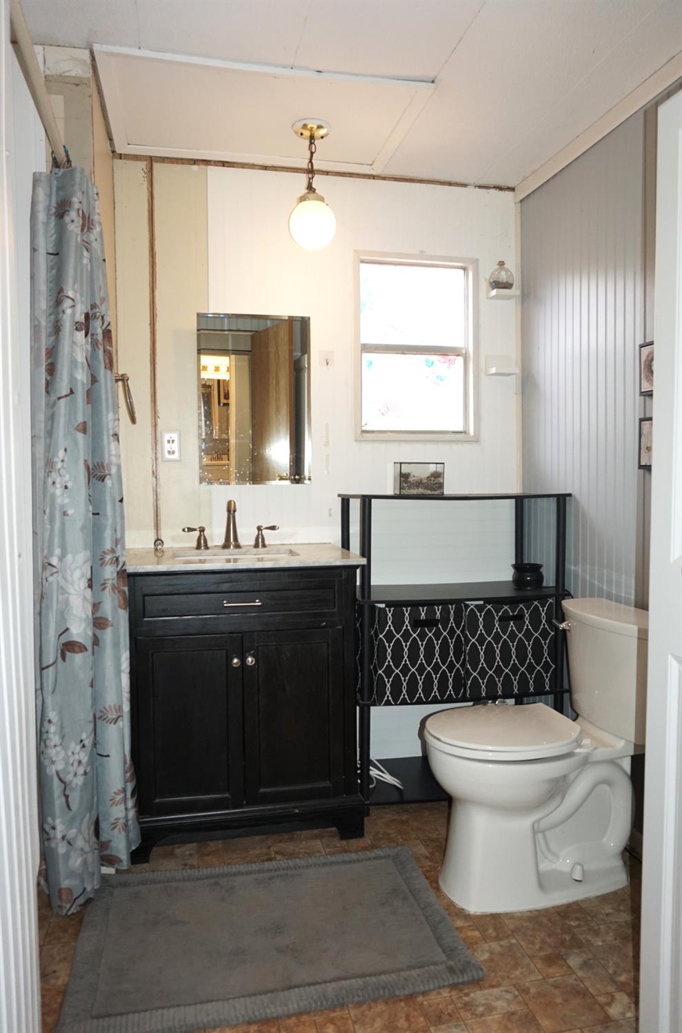 20480 Timber Ridge Road Pine Grove, CA 95665 - Photo 48 of 56 a bathroom with a sink toilet a mirror and shower