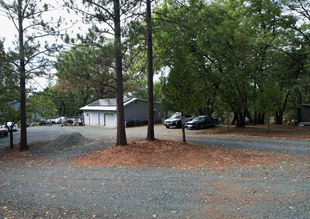 a view of backyard with patio
