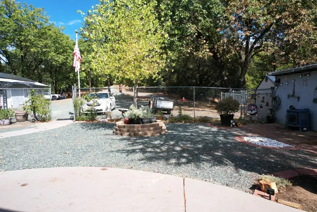a view of a backyard with a patio