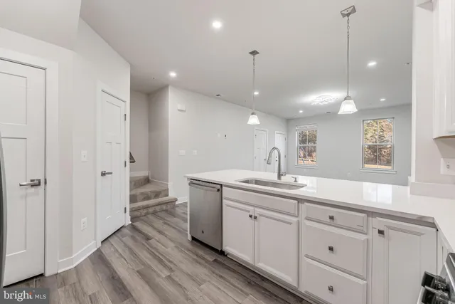 a bathroom with a sink a mirror and a shower