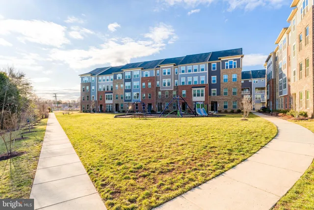 a swimming pool with outdoor seating and yard