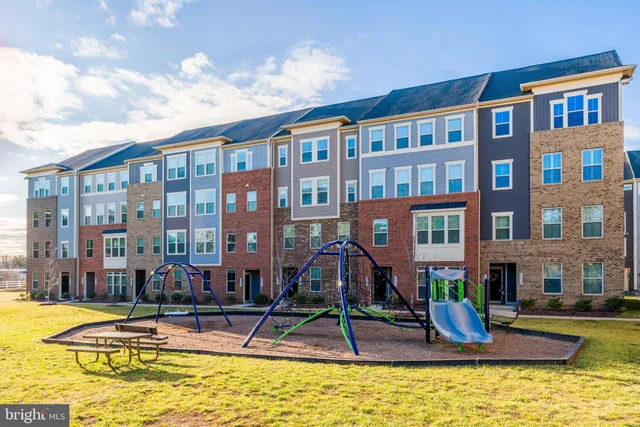a view of residential houses with outdoor space