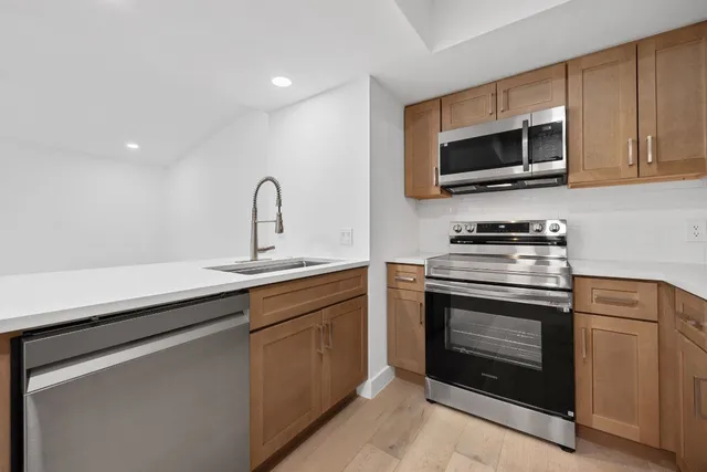 a kitchen with a sink and cabinets
