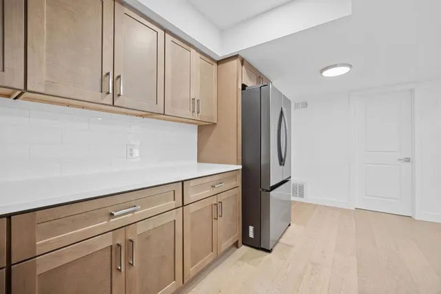 a kitchen with stainless steel appliances granite countertop a stove microwave and sink