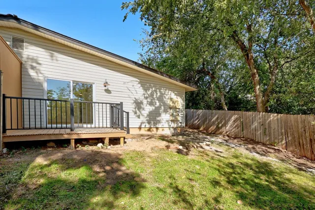a view of outdoor space with wooden fence
