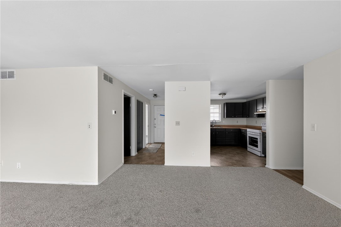 6070 Charlesgate Road Huber Heights, OH 45424 - Photo 9 of 29 This inviting space features an open layout with durable flooring and ample natural light.