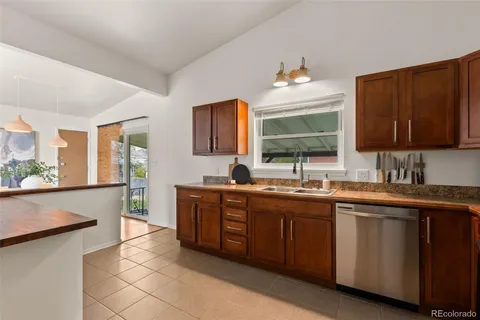 a kitchen with a sink stove and microwave