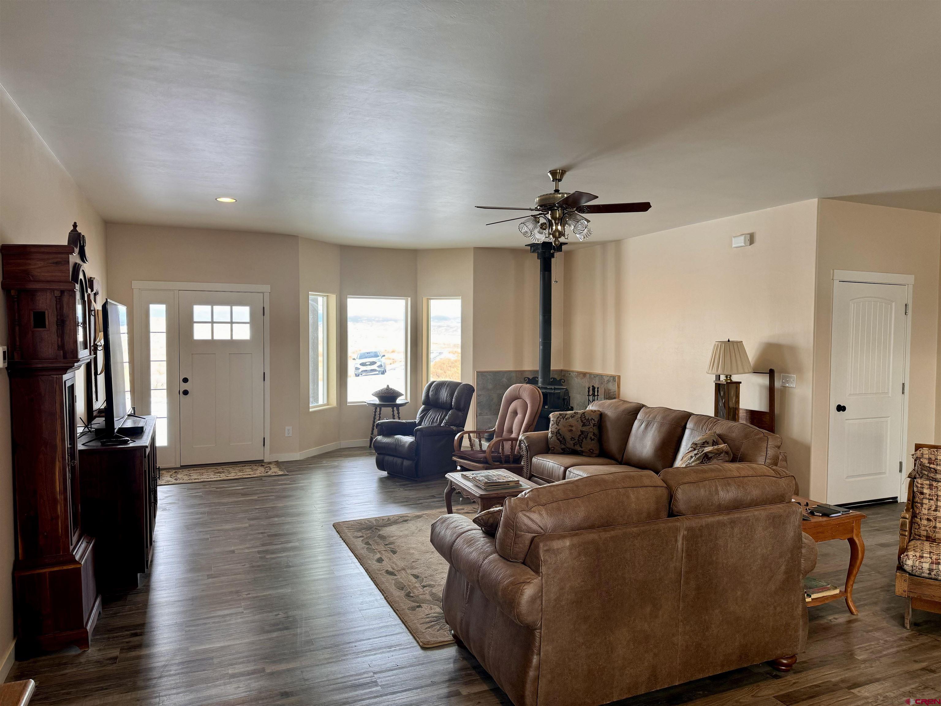 23184 D50 Road Delta, CO 81416 - Photo 5 of 23 a living room with furniture and a chandelier