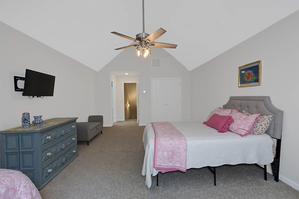 6712 Bridge Way Columbus, GA 31904 - Photo 28 of 36 a bedroom with a bed and a flat screen tv