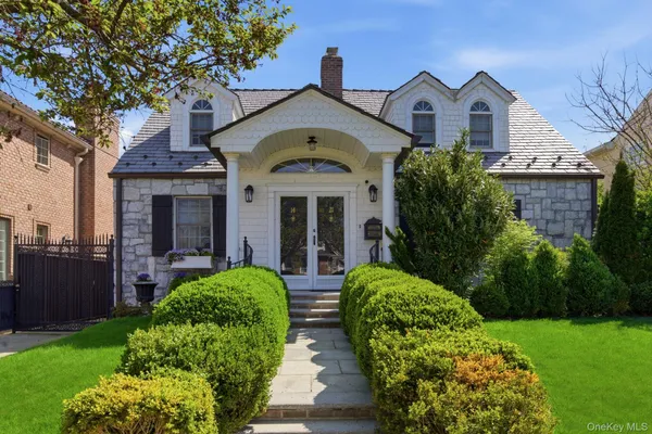 a front view of a house with garden