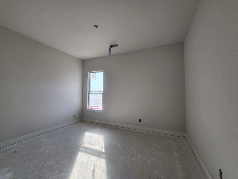 12412 Delta Court Krum, TX 76249 - Photo 11 of 18 an empty room with a window