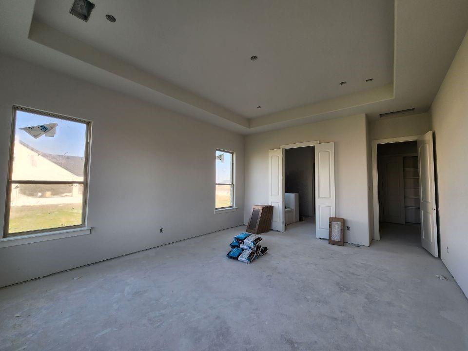 12412 Delta Court Krum, TX 76249 - Photo 15 of 18 an empty room with windows and closet
